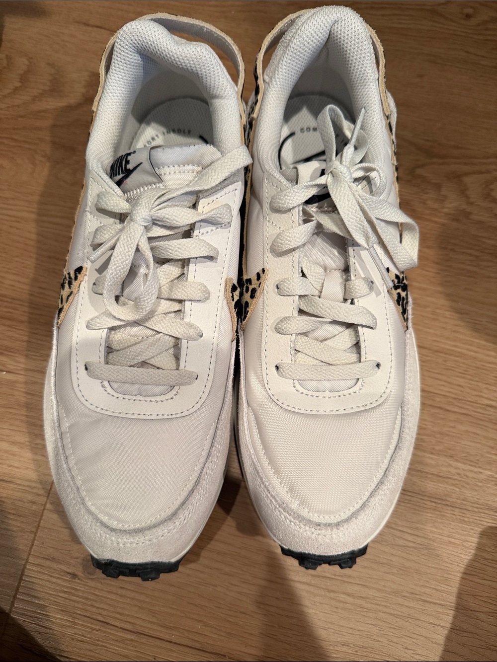 WORN ONCE! Nike Women’s White Sneakers with Leopard Swoosh Accent